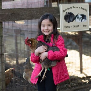 Happy Girl With Rooster